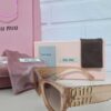 Óculos de Sol Miu Miu Transparente Marrom