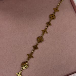 Pulseira Feminina Aco Inoxidavel 316L Dourado De elos com flores de quatro petalas cravejadas Antialergico